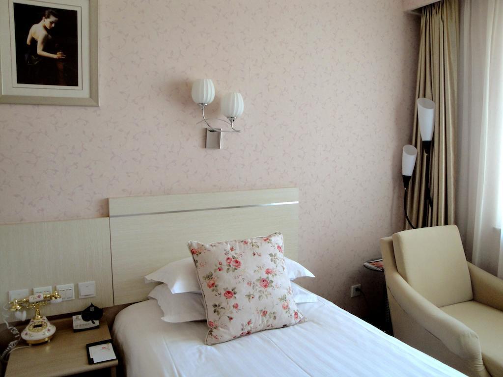 Overseas Chinese International Hotel ชิงเต่า ภายนอก รูปภาพ