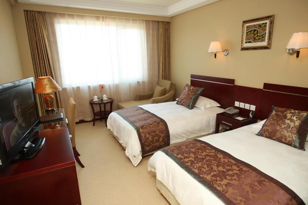 Overseas Chinese International Hotel ชิงเต่า ภายนอก รูปภาพ