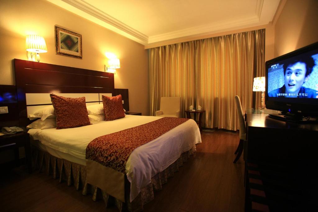 Overseas Chinese International Hotel ชิงเต่า ห้อง รูปภาพ