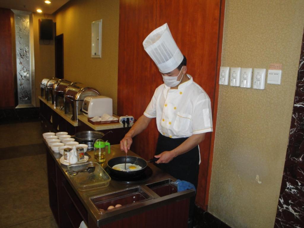 Overseas Chinese International Hotel ชิงเต่า ภายนอก รูปภาพ