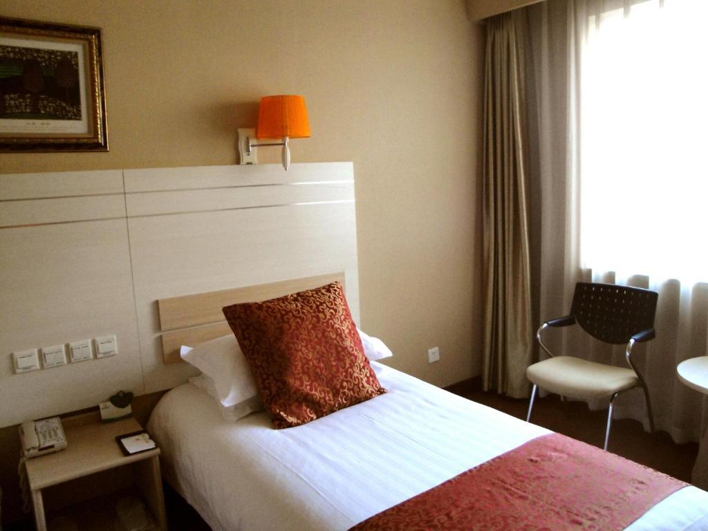 Overseas Chinese International Hotel ชิงเต่า ห้อง รูปภาพ