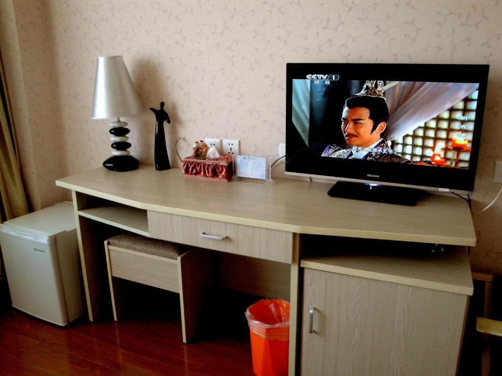 Overseas Chinese International Hotel ชิงเต่า ห้อง รูปภาพ
